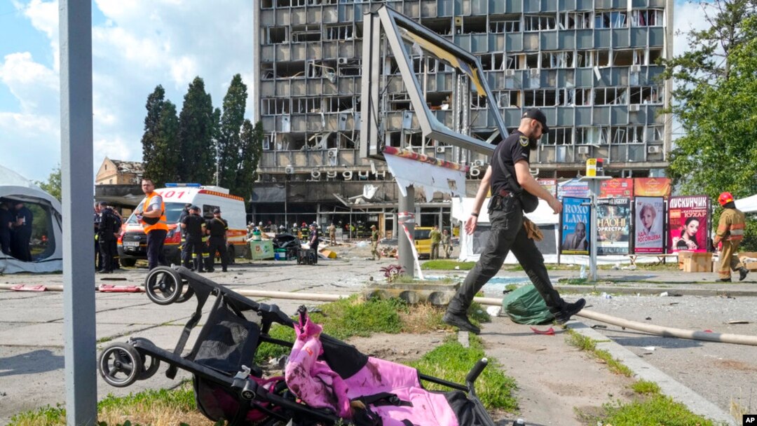 A baby stroller lies by a road after a deadly Russian missile attack in Vinnytsia, Ukraine, July 14, 2022. 