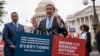 FILE - Democratic Senator Chris Murphy is joined at left by Senator Alex Padilla, also a Democrat, as they speak to activists demanding action on gun control legislation, at the Capitol, in Washington, May 26, 2022. 