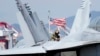 AQShning yadro qurollari bilan johozlangan "USS Ronald Reagan" avianosetsidagi "F/A-18 Hornet" qiruvchi samolyoti, 2022-yil, 23-sentabr