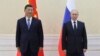 Chinese President Xi Jinping, left, and Russian President Vladimir Putin pose for a photo on the sidelines of the Shanghai Cooperation Organisation summit in Samarkand, Uzbekistan, Sept. 15, 2022. (Sputnik, Kremlin Pool photo via AP)