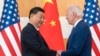 FILE - U.S. President Joe Biden, right, and Chinese President Xi Jinping shake hands before a meeting on the sidelines of the G20 summit meeting on Nov. 14, 2022, in Bali, Indonesia. 