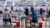FILE - Women operate sewing machines in a garment factory at the Hawassa Industrial Park, in Hawassa, southern Ethiopia, October 1, 2019.
