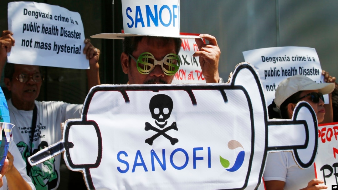 Protesters rally at the Sanofi Pasteur office in suburban Taguig city to protest the drug company's deal with the government for the anti-dengue vaccine Dengvaxia, March 5, 2018, east of Manila, Philippines. The vaccine was administered to more than 830,000 school children and adults before being pulled from the shelves after new study showed it posed risks of severe cases in people without previous infection.