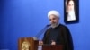 FILE - Iran's President Hassan Rouhani speaks to a group of Iranian women in Tehran.