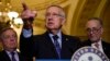FILE - Senate Minority Leader Harry Reid of Nevada, flanked by Senate Minority Whip Richard Durbin of Illinois, left, and Senate Minority Leader-elect Charles Schumer of New York, answers questions from the media after the Democratic policy luncheon on Capitol Hill in Washington, Dec. 6, 2016.