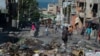Residents evacuate Poste Marchands in Port-au-Prince, Haiti on December 9, 2024, after gangs took control of the region on December 7. Nearly 200 people in Haiti were killed in brutal weekend violence reportedly orchestrated against voodoo practitioners.