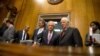 FILE - Senate Foreign Relations Committee Chairman Sen. Bob Corker, R-Tenn., center, speaks with the committee's ranking member Sen. Ben Cardin, D-Md., on Capitol Hill in Washington, April 14, 2015.