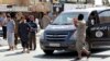 An Islamic State militant uses a loud-hailer to announce to residents of Tabqa city that Tabqa air base has fallen to Islamic State militants, in nearby Raqqa city, Syria, Aug. 24, 2014.