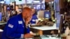 Traders work on the floor at the New York Stock Exchange in New York, Tuesday, June 14, 2022. Wall Street is wobbling between gains and losses Tuesday in its first trading after tumbling into a bear market on worries about a fragile economy and rising rat