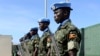 Ugandan peacekeeping troops stand during a ceremony at Mogadishu airport in Somalia May 18, 2014. U.N.-backed peacekeepers pushed the Islamist fighters out of Mogadishu in 2011, but the al Qaida-linked group has continued to launch guerrilla-style attacks.