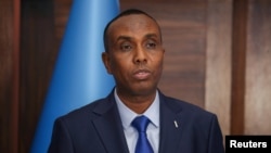 Somalia's newly appointed prime minister, Hamza Abdi Barre, addresses delegates at the Presidential Palace in Mogadishu, Somalia, June 15, 2022. (Presidential Press Service/Reuters)