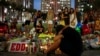 Local resident Jean Dasilva mourns for his deceased friend Javier Jorge-Reyes at a makeshift memorial in downtown Orlando for victims of the gay nightclub shooting, in Orlando, Florida, June 14, 2016.