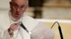 FILE - Pope Francis inside the Cathedral Santa Maria del Fiore during his visit to Florence, Italy, Nov. 10, 2015.