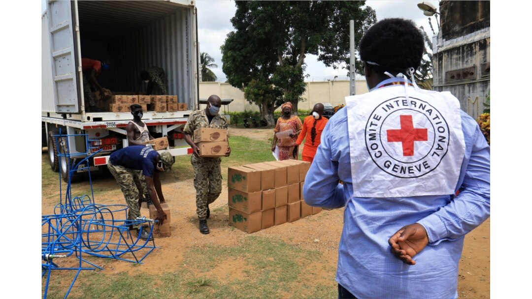 Guards from a prison unload an International Committee of the Red Cross truck containing sanitary kit amid the coronavirus disease outbreak in Dabou, Ivory Coast, April 16, 2020.