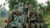 Congolese armed forces (FARDC) soldiers ride on their pick-up truck as they advance to a new position while battling M23 rebels in Kibati near Goma, in the eastern Democratic Republic of Congo, Sept. 2, 2013.