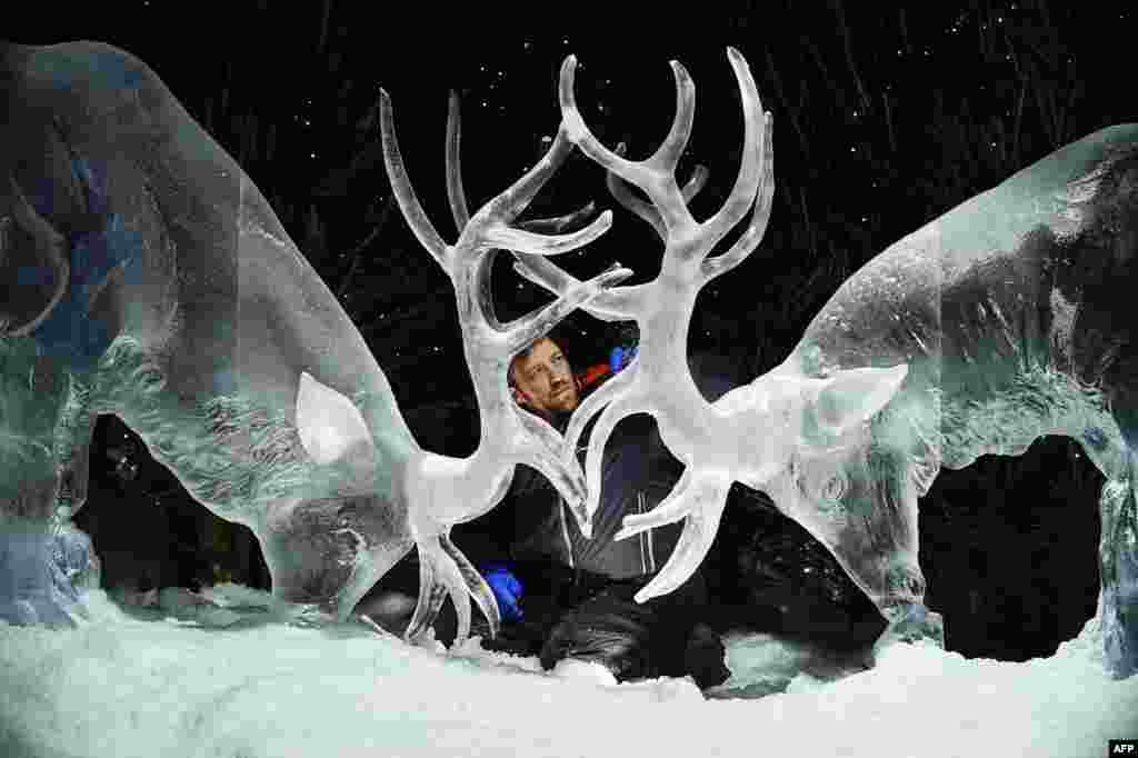 Ice sculptor Darren Jackson puts the finishing touches to an ice sculpture of two stags, which makes up part of a forthcoming exhibition, &quot;The Ice Adventure: A Journey Through Frozen Scotland,&quot; in Edinburgh, Scotland, Nov. 14, 2017.