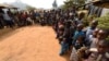 FILE - Cameroonians, including women and children, refugees from the Cameroon's restive anglophone regions, gather for a meeting at Bashu-Okpambe village, in Boki district of Cross Rivers State in Nigeria, Jan. 31, 2018.