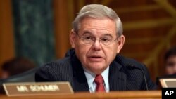 Sen. Robert Menendez, D-N.J. addresses fellow members of the Senate Banking Committee in Washington, Jan. 27, 2015.