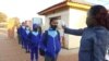 Students in Gaborone are checked for temperature before lessons start as part of new health regulations. (Photo: Mqondisi Dube)