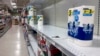 Near empty shelves are seen in the paper goods section of a supermarket, Jan. 13, 2022, in Orlando, Florida.