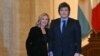 Italian Prime Minister Giorgia Meloni welcomes Argentinian President Javier Milei at Palazzo Chigi prior to their meeting in Rome on Dec. 13, 2024.