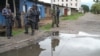 FILE - Burundian police and soldiers guard a deserted street in Bujumbura, Burundi.