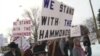 FILE - In a video grab, members of a militia group in the northwestern U.S. state of Oregon are seen rallying in support of two ranchers they say have received an unjust court sentence. 