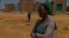  Letay Girmay, 50, says she and other Hawzen residents buried the bodies of many civilians after battles in Hawzen, Ethiopia, on June 6, 2021. (VOA/Yan Boechat) 