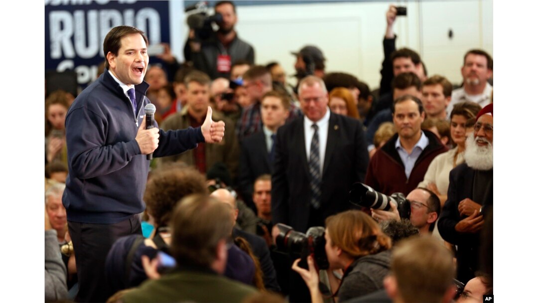 Republican presidential candidate Sen. Marco Rubio, R-Fla., works to charge up a crowd during a campaign stop in a high school cafeteria, in Londonderry, N.H., Feb. 7, 2016.