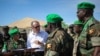 U.N Deputy Secretary-General Jan Eliasson (2nd L) speaks with medical staff from the Ugandan Contingent serving with the African Union Mission in Somalia, in Mogadishu October 27, 2013 (U.N. photo/Stuart Price).