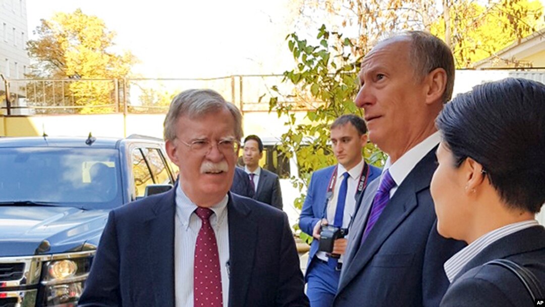 U.S. National Security Adviser John Bolton, left, and Russian Security Council chairman Nikolai Patrushev talk prior their official talks in Moscow, Russia, Oct. 22, 2018. 