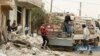 In this photo provided Jan. 4, 2018, by the Syrian anti-government activist group, Edlib Media Center, EMC, which has been authenticated based on its contents and other AP reporting, shows Syrian citizens load their belongings at a pickup, as they flee their house which was attacked by Russian airstrikes, in Tel al-Toukan village, eastern Idlib province, Syria.