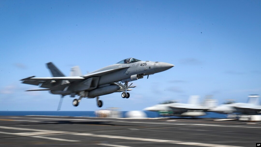An F/A-18E Super Hornet lands on the flight deck of the Nimitz-class aircraft carrier USS Abraham Lincoln in the Arabian Sea, May 20, 2019. 