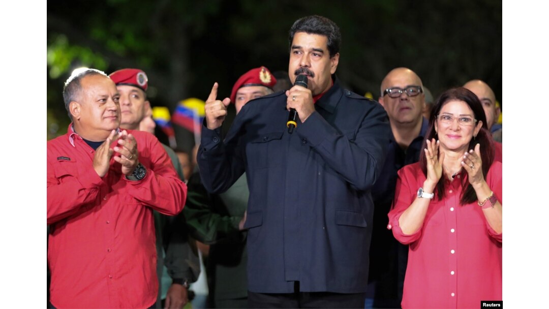 Venezuela's President Nicolas Maduro, meeting with government members, celebrates the ruling Socialist Party winning more governorships, in Caracas. Oct. 15, 2017.