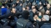 Demonstrators scuffle with riot police during a protest against the detention of the head of the Turkish Medical Association and other leaders of the doctors' union, in Ankara, Turkey, Jan. 30, 2018.