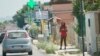 Nigerian streetwalker on the main street in Castel Volturno plying her trade. Italian authorities say one out of every two sex worker on the roads of Italy are Nigerian. (Photo: Jamie Dettmer for VOA)