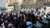 FILE - Iranian students scuffle with police at the University of Tehran during a demonstration driven by anger over economic problems, in the capital Tehran, Iran, Dec. 30, 2017. 