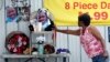 A woman touches a makeshift memorial for Alton Sterling, outside a convenience store in Baton Rouge, Louisiana, July 6, 2016. Sterling was shot and killed by police outside the store.
