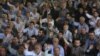 FILE - Iranian worshippers chant slogans against Bahraini regime and Saudi Arabia during Friday prayers in Tehran, Iran, May 26, 2017.