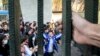 FILE - University students attend an anti-government protest at Iran's Tehran University, Dec. 30, 2017. The photo, obtained by the Associated Press, was taken by an individual not employed by AP. 