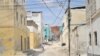 FILE - A handout photo taken on February 12, 2016 and released by AMISOM shows an elderly man walking through a street alley in the Somali port city of Merca, Lower Shabelle Region, Somalia. 