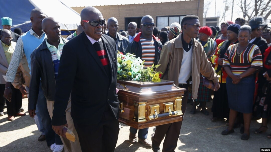 Mourners carry the casket of Andries Motlapula Ntsenyeho, one of the 34 striking platinum mineworkers shot dead at Lonmin's Marikana mine, in his hometown of Sasolburg in South Africa's Free State province, September 1, 2012.