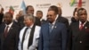 Sudanese president Omar al-Bashir, right, stands with other African leaders during a photo op at the AU summit in Johannesburg, June 14, 2015. 