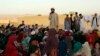 FILE - Matiullah Wesa, a girls' education advocate, reads to students in the Spin Boldak district in the southern Kandahar province of Afghanistan on May 21, 2022. The Taliban freed the activist on Oct. 26, 2023, after holding him in prison for 215 days.