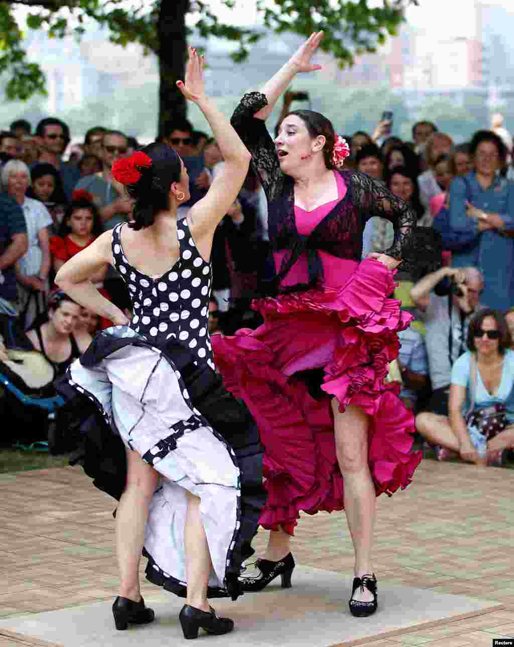 Flamenco dancers perform on the South Bank during an Andalusian carnival, in central London.