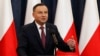 Poland's President Andrzej Duda tells a news conference he has decided to sign two laws that will put courts under more political control even though they are part of a review a concerned European Union is conducting in Warsaw, Poland, Dec. 20, 2017. 