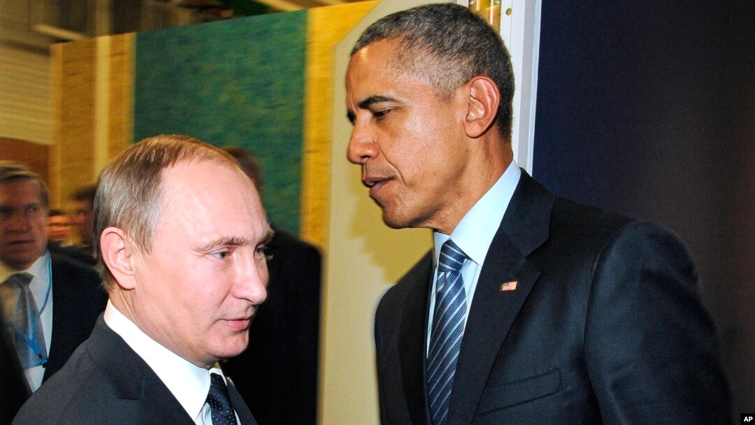 Russian President Vladimir Putin, left, and President Barack Obama shake hands at the COP21 U.N. Conference on Climate Change in Paris, Nov. 30, 2015.