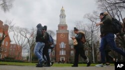 FILE - Brooklyn College students walk between classes on campus in Brooklyn, New York, Feb. 1, 2017.