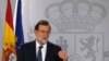 Spain's Prime Minister Mariano Rajoy gestures as he delivers a statement at the Moncloa Palace in Madrid, Oct. 11, 2017. 