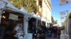 Shoppers skip the mall for DC's Downtown Holiday Market. (J.Taboh/VOA)